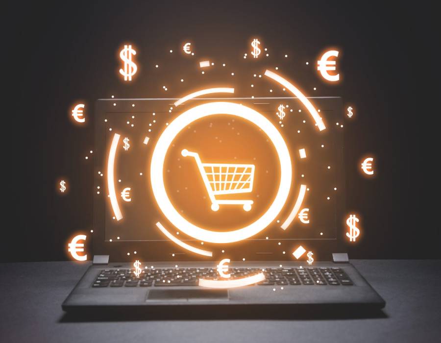 Online shopping on laptop with cart icon - Pexels